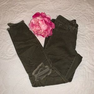 Olive distressed skinny jeans